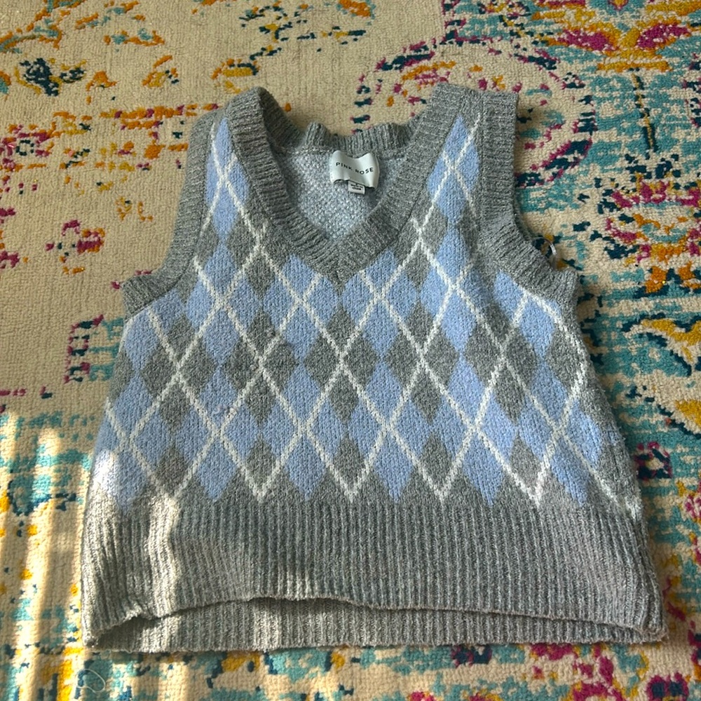Adorable blue, white, and grey sweater vest.